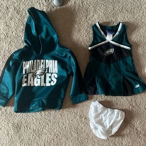 Philadelphia Eagles sweatshirt and cheerleader outfit
